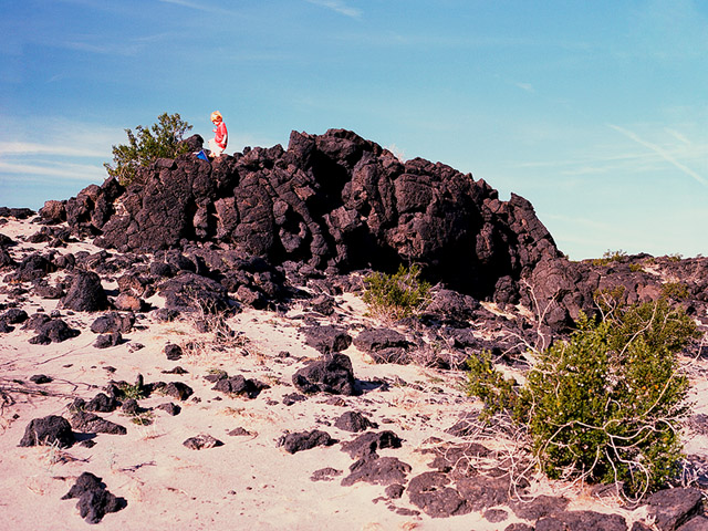 toddler kicking bucket on top of lava flow