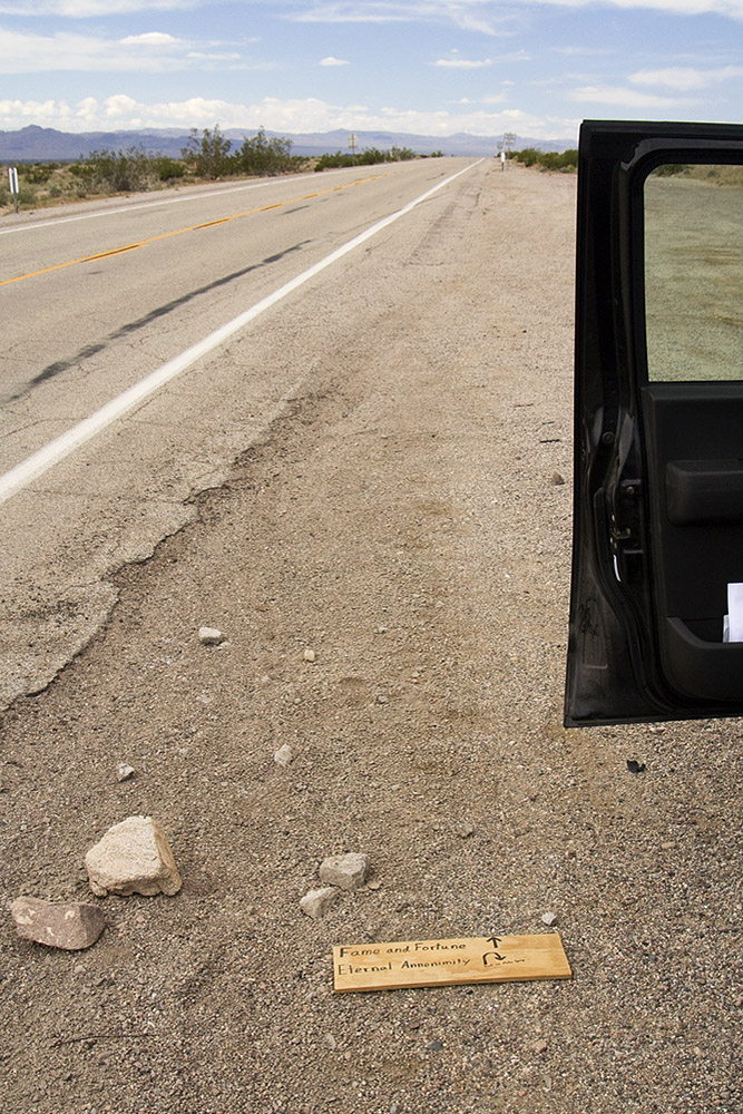 image of fame and fortune sign laying on the ground