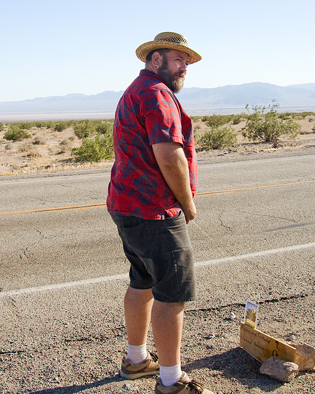 scott peeing on the sign of annonimity